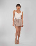 Mini falda beige con detalle de cinta