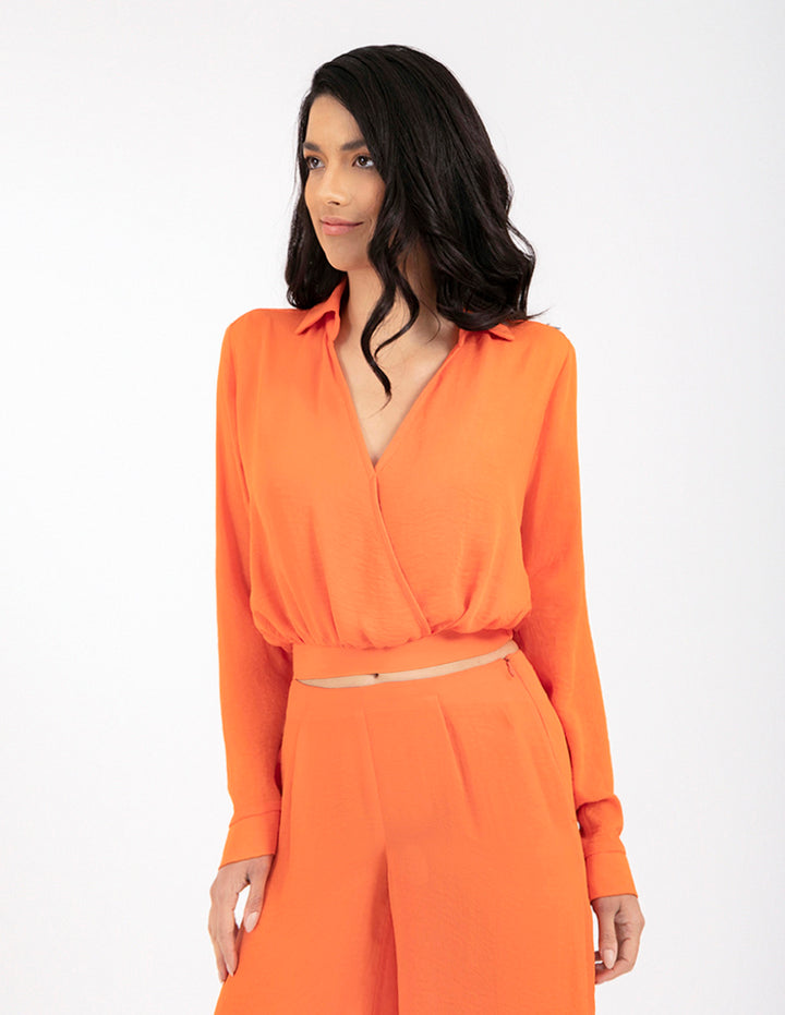 Blusa naranja manga larga con cruce