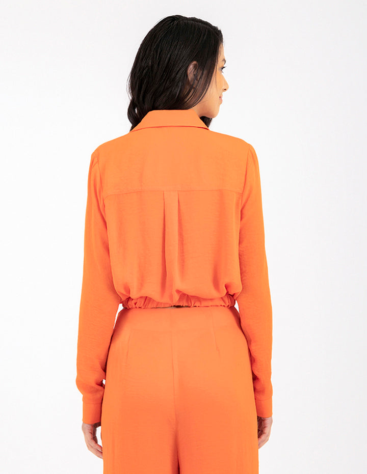 Blusa naranja manga larga con cruce