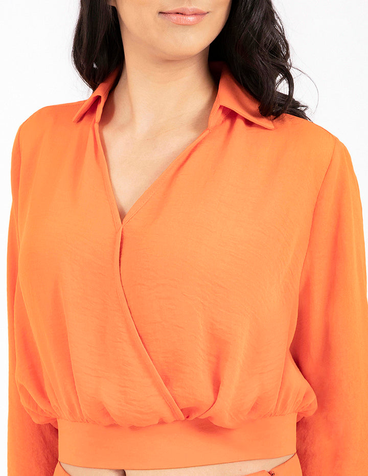 Blusa naranja manga larga con cruce