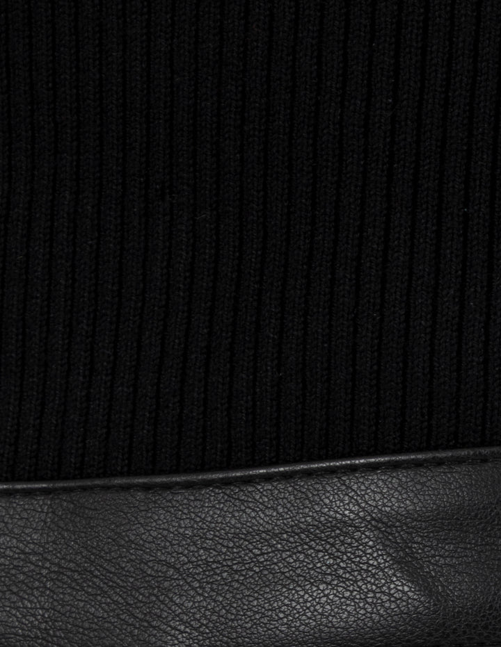 Vestido negro de cuello alto con efecto de falda vinipiel