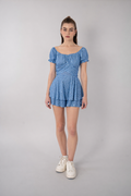 Jumpsuit azul estampado con diseño de moño