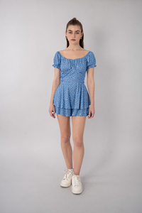Jumpsuit azul estampado con diseño de moño