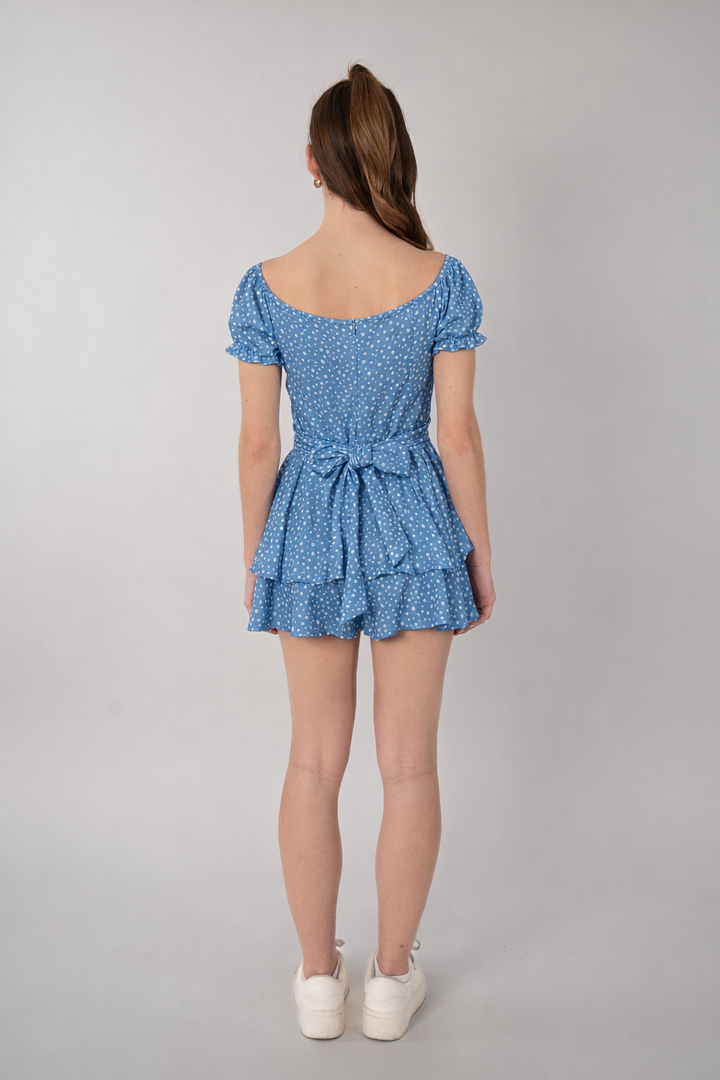 Jumpsuit azul estampado con diseño de moño