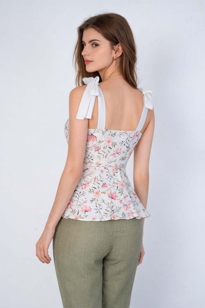 Blusa floreada con moño en tirantes