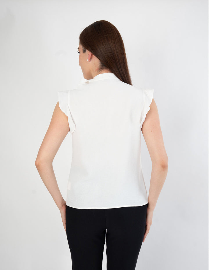 Blusa con detalle en cuello (disponible en fiusha / ivory)