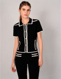 Blusa de tejido de punto negro con detalles blancos (Conjunto)