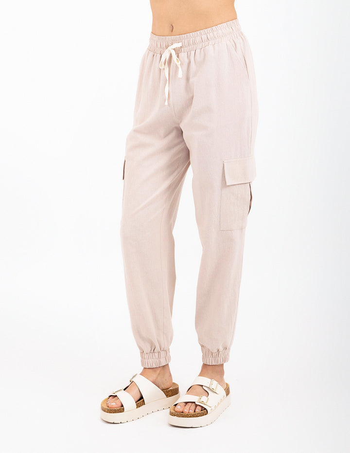 Pantalón de lino con bolsas laterales (disponible en blanco y beige)