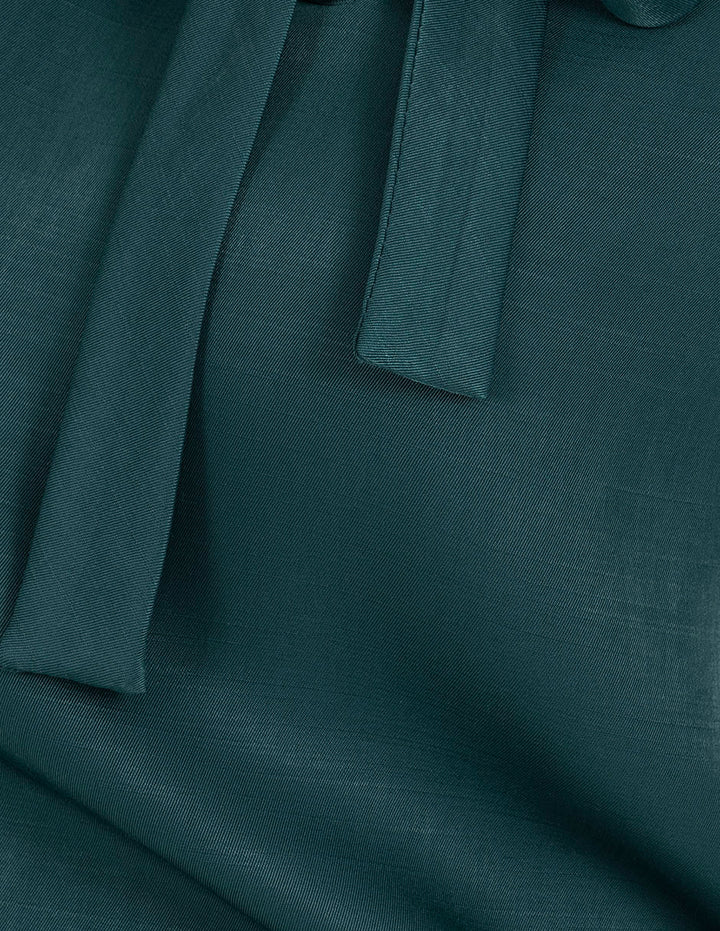 Blusa verde de mangas 3/4 y detalle en cuello