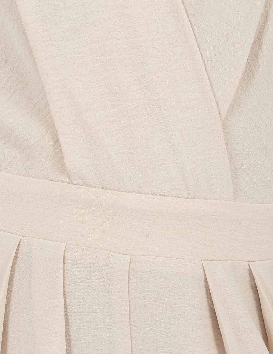 Jumpsuit largo beige con detalle de escote en la espalda