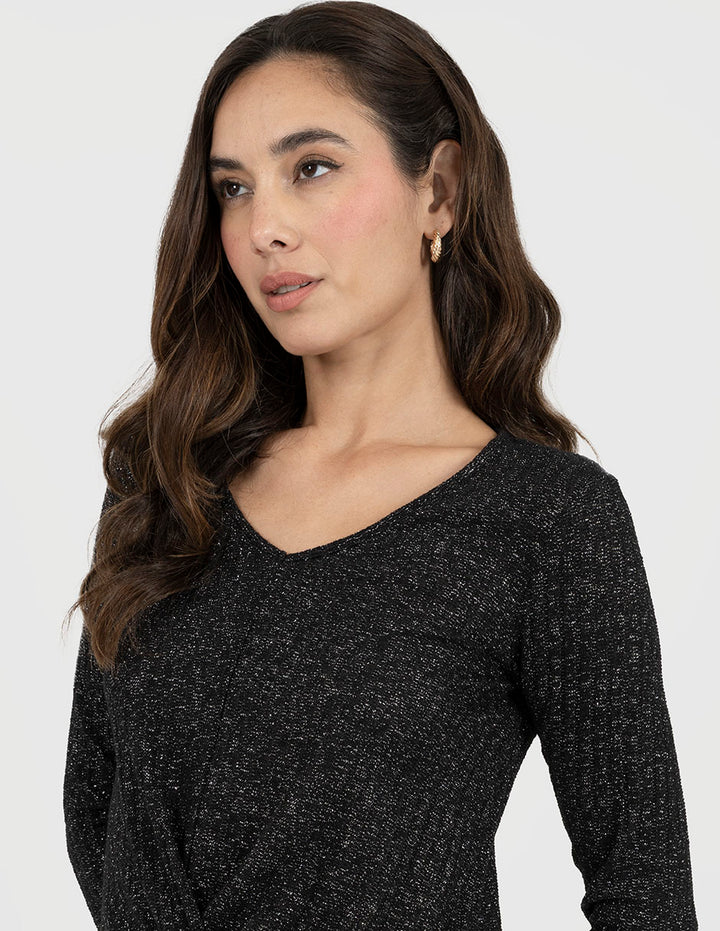 Blusa negra con brillos y manga 3/4