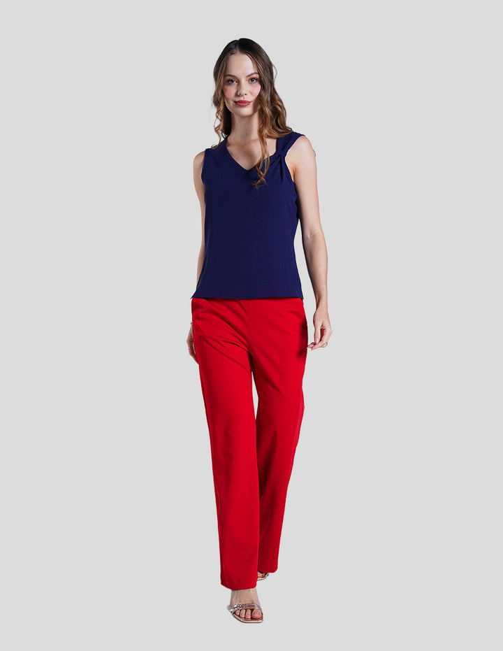 Blusa azul marino sin mangas y detalle de moño en hombro