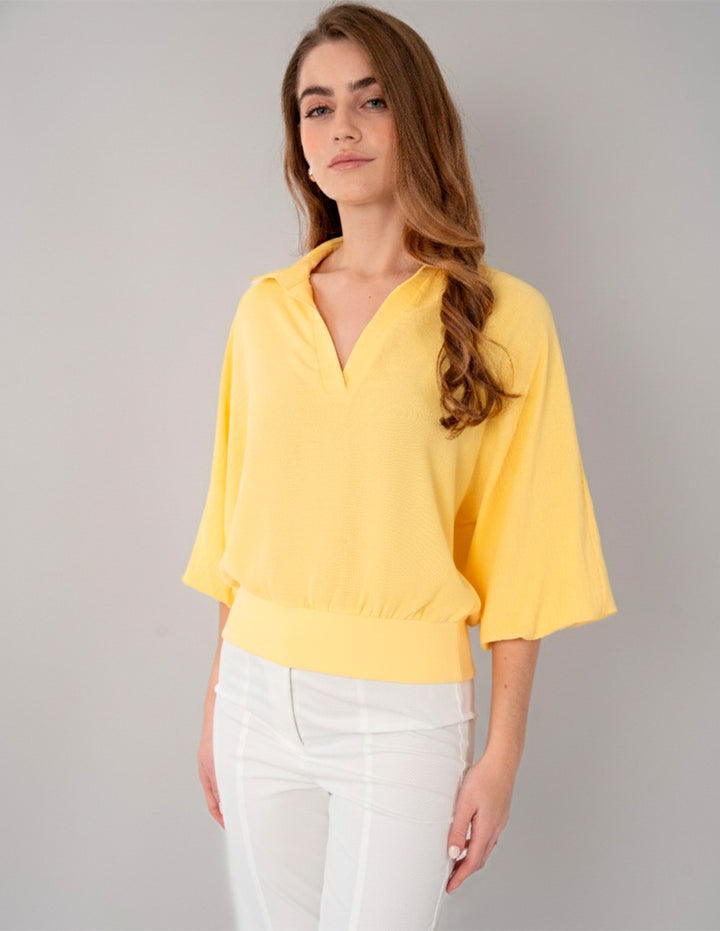 Blusa amarilla de manga larga y escote V
