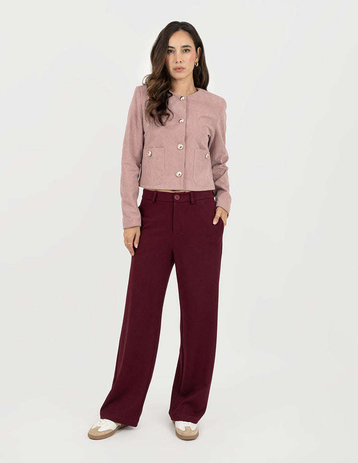 Suéter rosa corto y botones enfrente